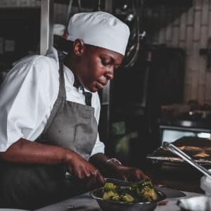 Chef (African American) preparing food.