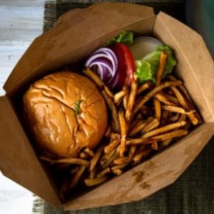 A boxed lunch containing a hamburger and French fries.
