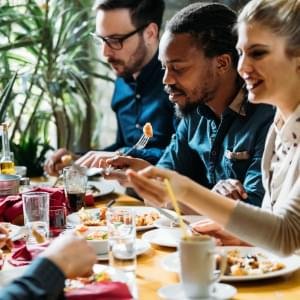 A group of people eating dinner.